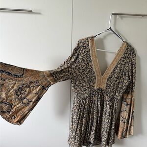 Free people romper floral V neck flowy sleeves back cutout